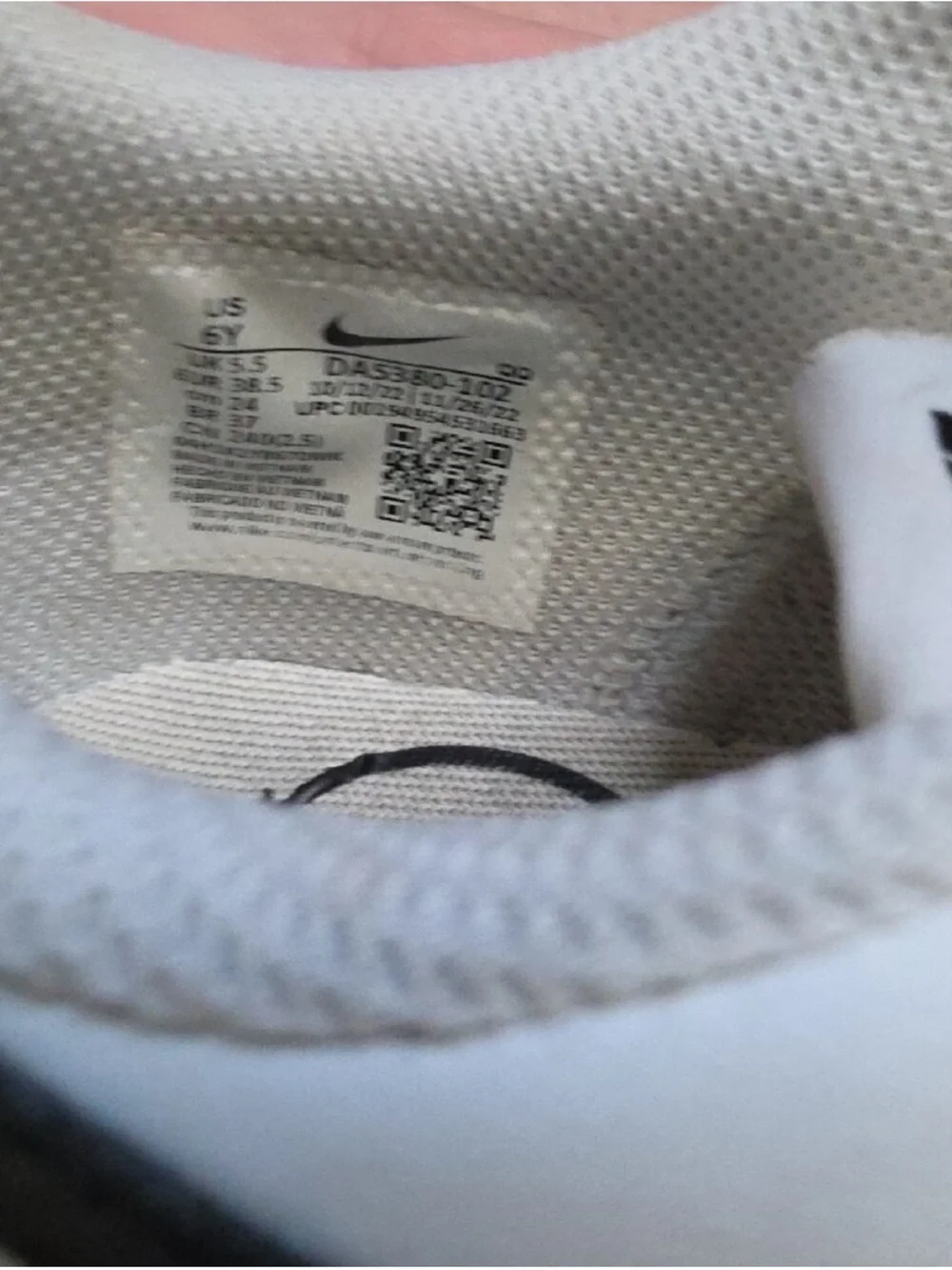 Nike White Sneakers with Black Swoosh and Tan Accent